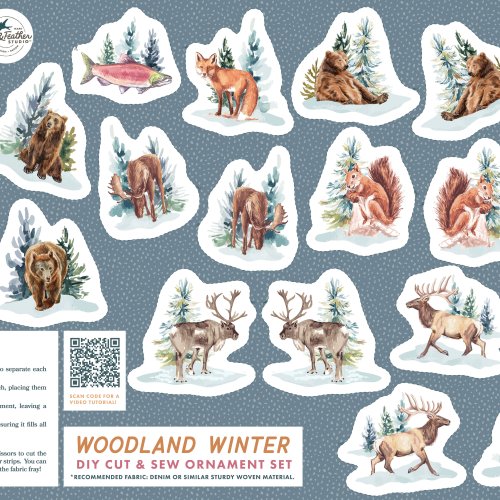 Woodland Winter DIY cut-and-sew fabric panel featuring watercolor illustrations of woodland animals such as bears, moose, foxes, owls, squirrels, reindeer, and fish. The animals are depicted alongside snow-covered trees on a blue background with a snowy dotted pattern. The panel includes detailed sewing instructions, a QR code for a video tutorial, and the title 'Woodland Winter DIY Cut & Sew Ornament Set' in orange and blue text.