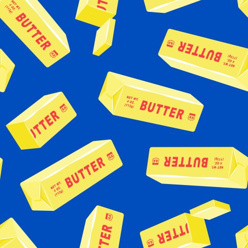 Butter Sticks tossed on a blue background. 