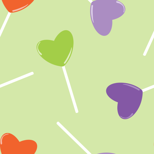 Tossed heart shaped candy suckers in orange, green, purple 