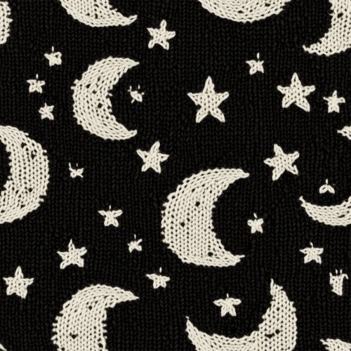 knitted white moons on black background